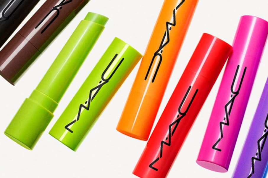 Model hand holding multiple MAC lip products